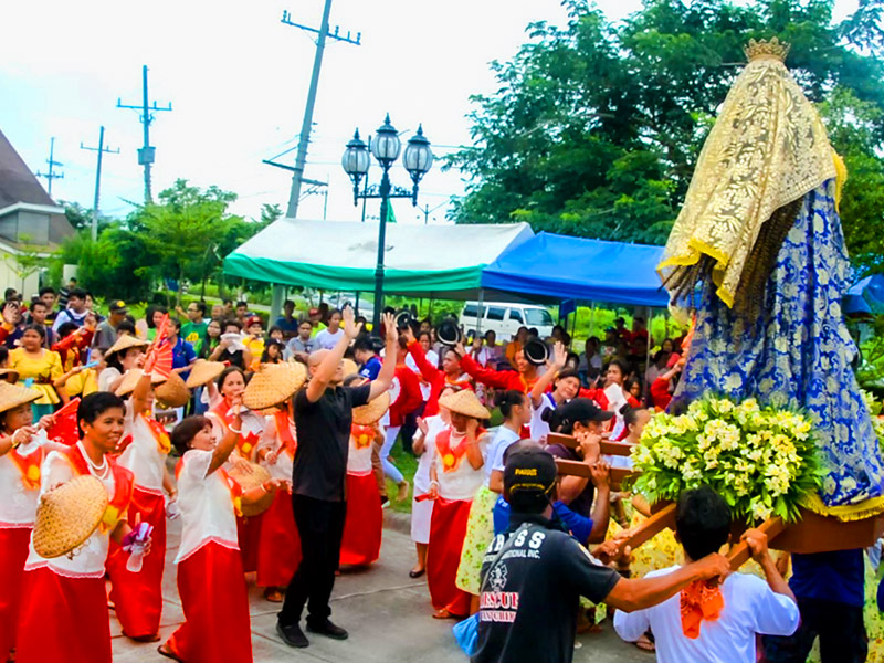 Image of the church community of Lancaster New City Cavite celebrating the Parish of the Holy Family annual fiesta.