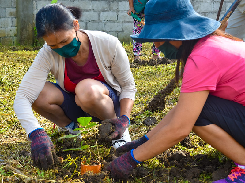 Micara Estates-Tanza residents during a tree-planting activity.