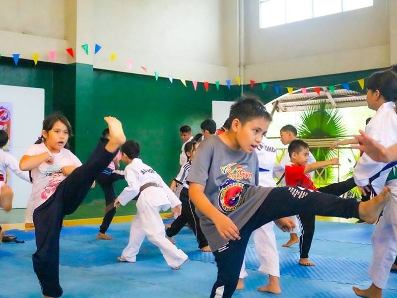 The youth of Parc Regency Residences in Pavia, Iloilo training for taekwondo.
